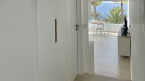 A hallway leading to a balcony with a view of the sea. - Relaxing Ocean Views, Closed to the Beach (San Bartolomé de Tirajana)