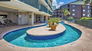 A pool area with lounge chairs and a sign indicating no diving allowed. - Ashworth 1001 4-Bedroom Oceanfront Condo, "Picture Perfect" (North Myrtle Beach)