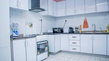 Apartment | Private kitchen | Fridge, microwave, oven, stovetop