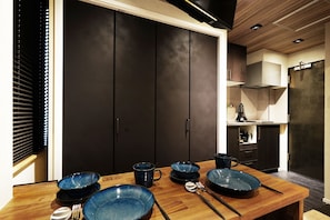 Fridge, microwave, coffee/tea maker, cookware/dishes/utensils