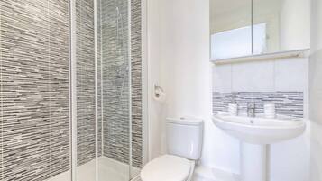 Bathtub, hair dryer, towels