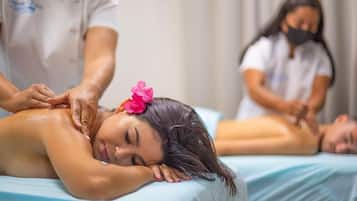 Expert massage therapy sessions take place in a serene, clinical setting with two treatment tables.