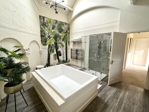 Separate tub and shower, deep soaking tub, hair dryer, towels