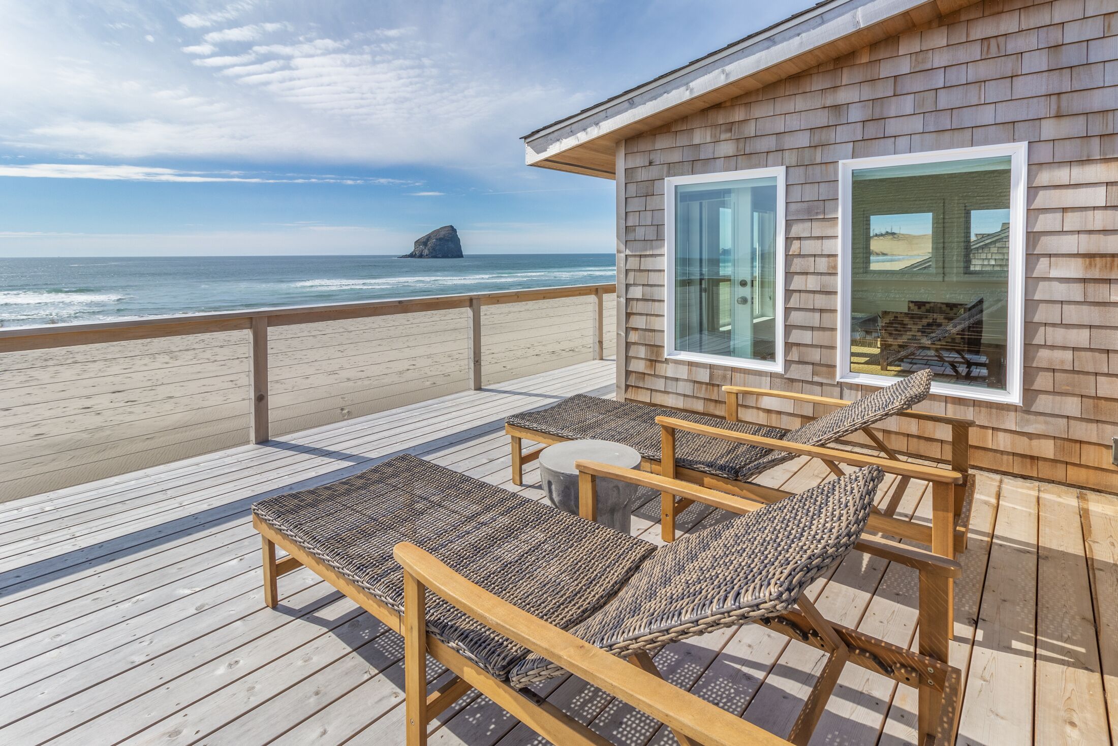 Spectacular Views from this Beachfront Home literally Steps to the Sand!