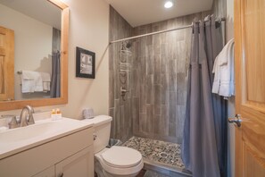 Shower, towels, soap, toilet paper