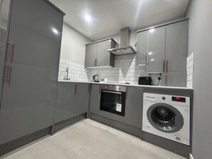 Apartment, 1 Queen Bed | Private kitchen | Fridge, microwave, oven, stovetop - Private Luxury Apartment - Free Parking & Wi-fi (Coventry)