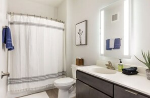 Combined shower/tub, hair dryer, towels, soap