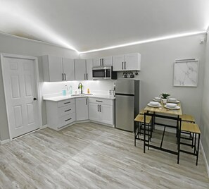 Fridge, microwave, stovetop, coffee/tea maker