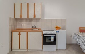 Fridge, stovetop, coffee/tea maker, cookware/dishes/utensils