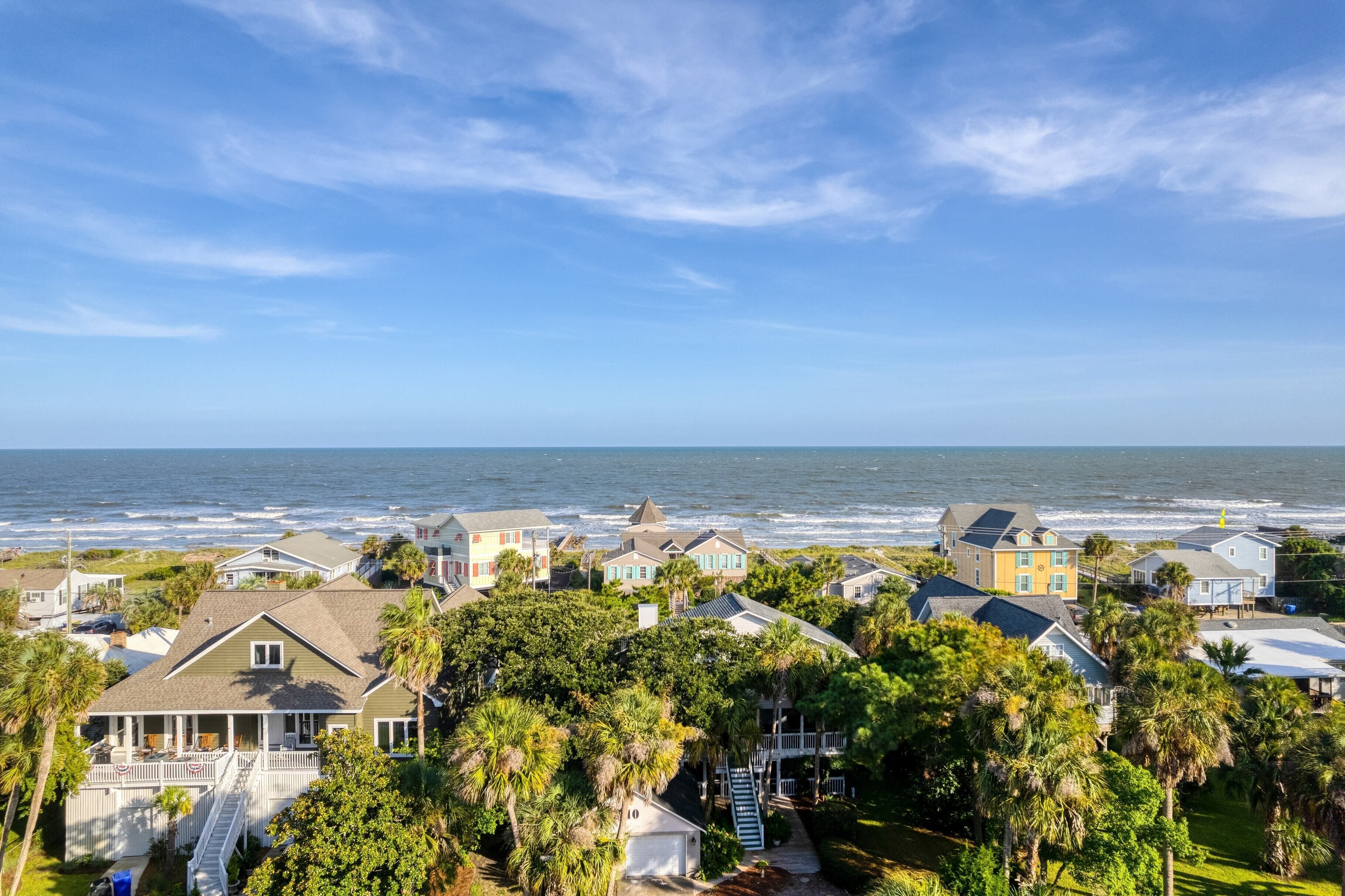 A coastal residential area with houses and a view of the ocean.