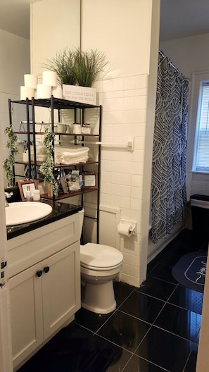 Combined shower/tub, hair dryer, towels, toilet paper