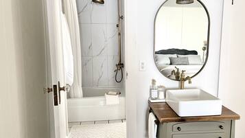 Combined shower/tub, hair dryer, towels, soap