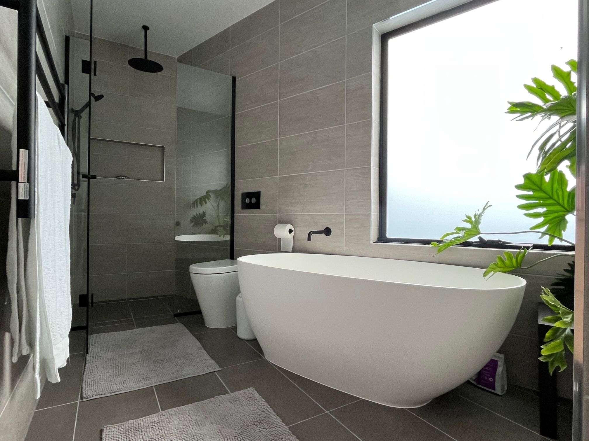 Bathtub, hair dryer, towels, soap