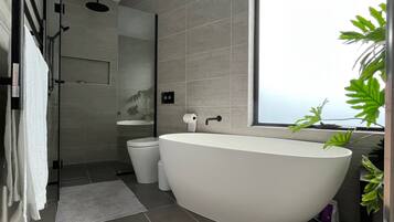Bathtub, hair dryer, towels, soap
