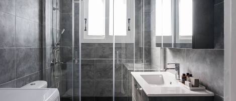 Shower, hair dryer, towels, soap