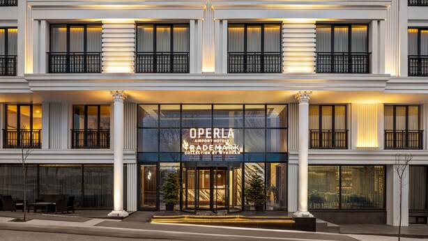 A multi-story hotel with a prominent entrance featuring a sign reading "OPERA TRADEMARK Collection by Wyndham." - Trademark Collection By Wyndham Operla İstanbul Airport Hotels (Arnavutköy)