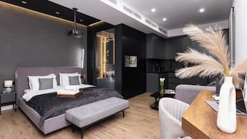 Signature Apartment | Premium bedding, desk, laptop workspace, blackout curtains