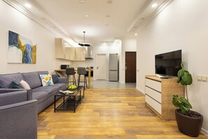 Signature Apartment | Living area | Flat-screen TV