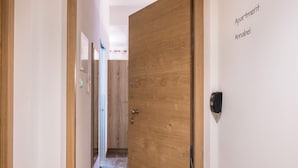A hallway leading to a wooden door labeled 'Apartment Annabel.' - Apartment "Annabel" with Mountain View, French Balcony & Wi-Fi (Bolzano)