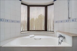Bathtub, hair dryer, towels