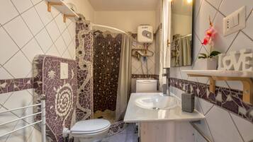 Shower, free toiletries, hair dryer, towels