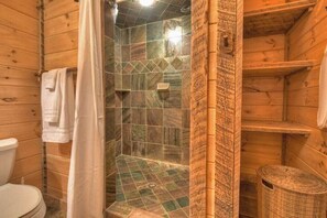 Bathtub, hair dryer, towels, shampoo