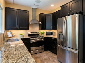 Fridge, coffee/tea maker, cookware/dishes/utensils