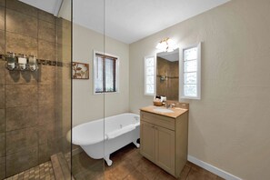 Bathtub, hair dryer, towels, soap