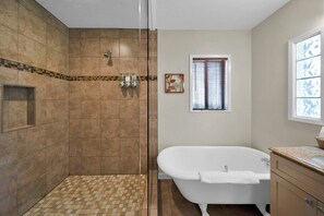 Bathtub, hair dryer, towels, soap