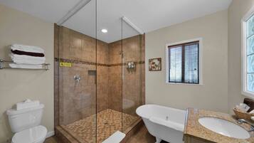 Bathtub, hair dryer, towels, soap