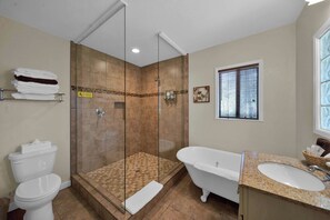 Bathtub, hair dryer, towels, soap