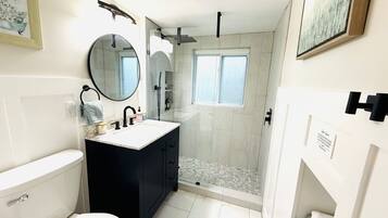 Combined shower/tub, hair dryer, towels, soap