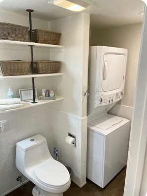 Combined shower/tub, hair dryer, towels, soap