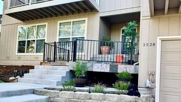 A two-story house with a front porch, a garage, and a mailbox. - Luxury 4 Bedroom + Hot Tub. (El Dorado Hills)