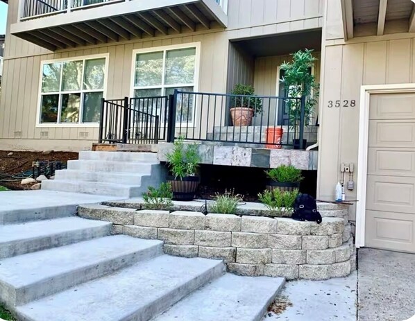 A two-story house with a front porch, a garage, and a mailbox. - Luxury 4 Bedroom + Hot Tub. (El Dorado Hills)