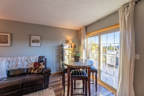 Relax in this inviting living room with a sofa, coffee table, and comfortable seating area.