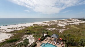 A resort with a swimming pool, beach access, and a view of the ocean. - Relaxing Gulf Views at the Beach Club in Fort Morgan! (Gulf Shores)