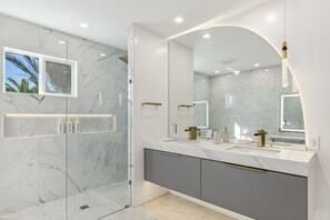 Combined shower/tub, hair dryer, towels, soap