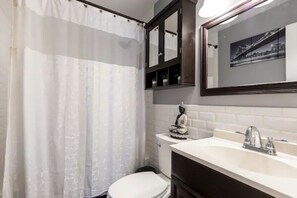 Combined shower/tub, hair dryer, towels, soap