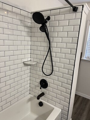 Combined shower/tub, hair dryer, towels, soap