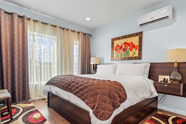 2 bedrooms, desk, blackout drapes, iron/ironing board