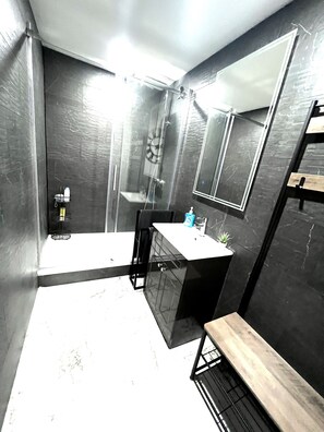 Bathtub, hair dryer, towels, soap