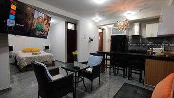 Family Apartment, 2 Bedrooms, Kitchen | Living area | 55-inch Smart TV with digital channels, Netflix, toys