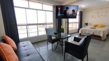 Family Apartment, 2 Bedrooms, Kitchen | Living area | 55-inch Smart TV with digital channels, Netflix, toys