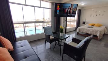 Family Apartment, 2 Bedrooms, Kitchen | Living area | 55-inch Smart TV with digital channels, Netflix, toys