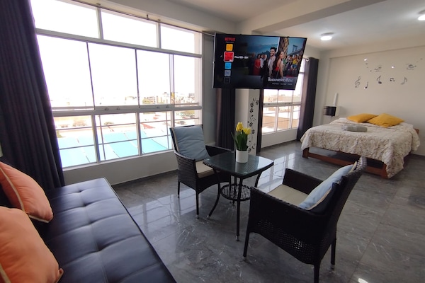 Family Apartment, 2 Bedrooms, Kitchen | Living area | 55-inch Smart TV with digital channels, Netflix, toys