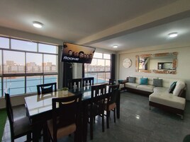 Premium Apartment, 3 Bedrooms, Kitchen, City View | Living area | 55-inch Smart TV with digital channels, Netflix, toys