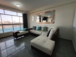 Premium Apartment, 3 Bedrooms, Kitchen, City View | Living area | 55-inch Smart TV with digital channels, Netflix, toys