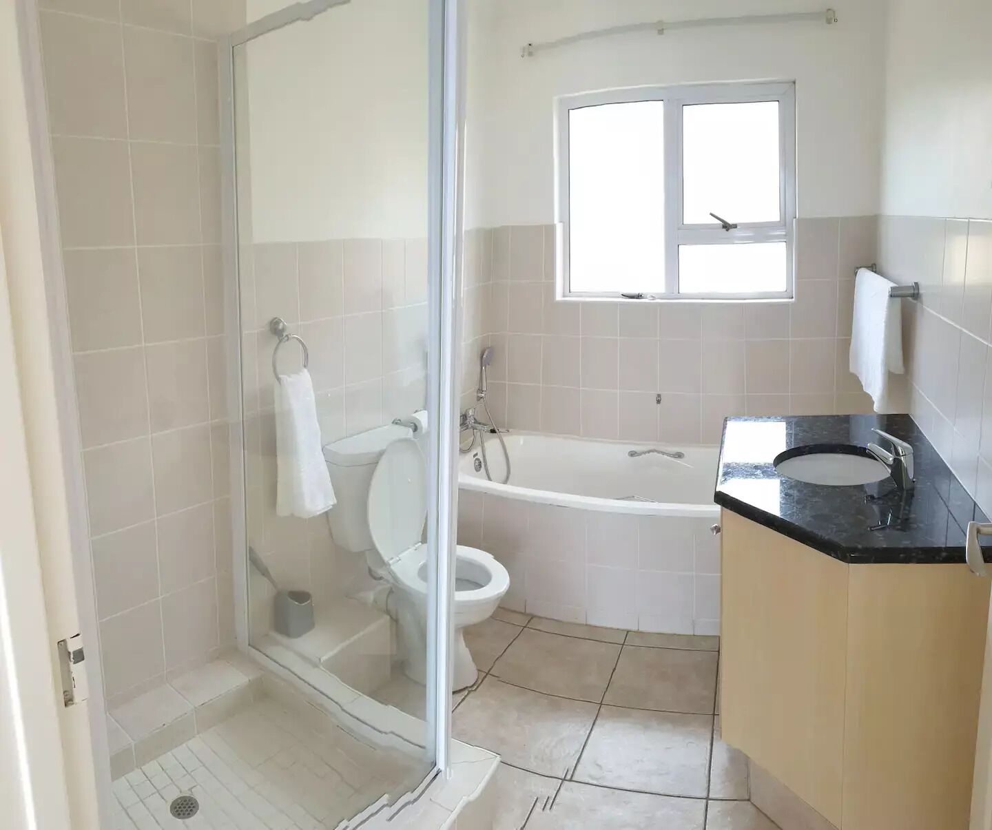 Bathtub, hair dryer, towels, soap
