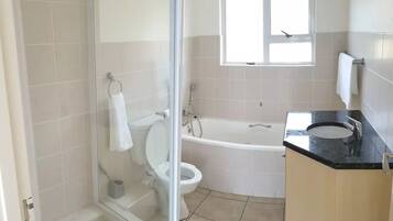 Bathtub, hair dryer, towels, soap